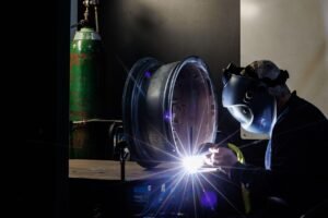 Man welding, wheel repair, metalworking, industrial welding, alloy wheel, dark, welding, welding, welding, welding, welding