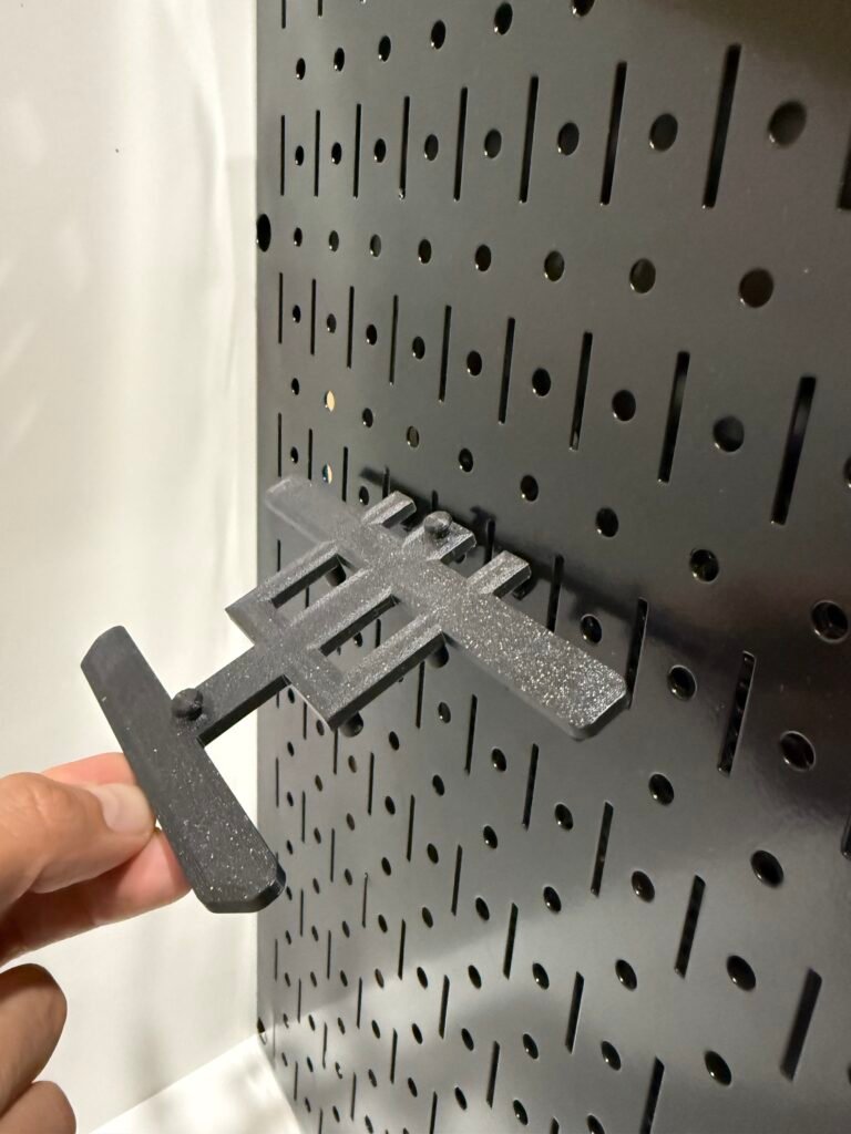 Installation of a mount to a metal Wall Control Peg Board.